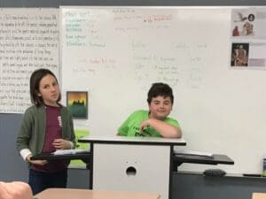 Two students reenacting Galileo's trial 