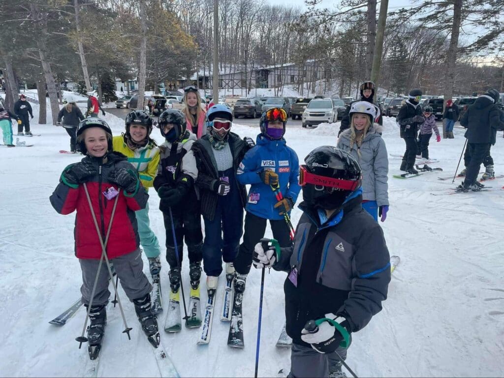 The Ivywood Ski Club pose for a picture on the hillside