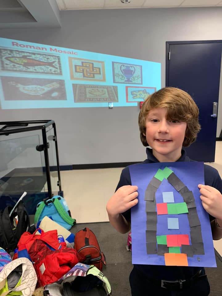 Our International Culture club poses with his roman mosaic