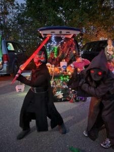 Students dressed for trunk or treat event