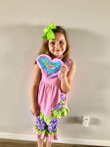 Student holding heart note for healthcare workers