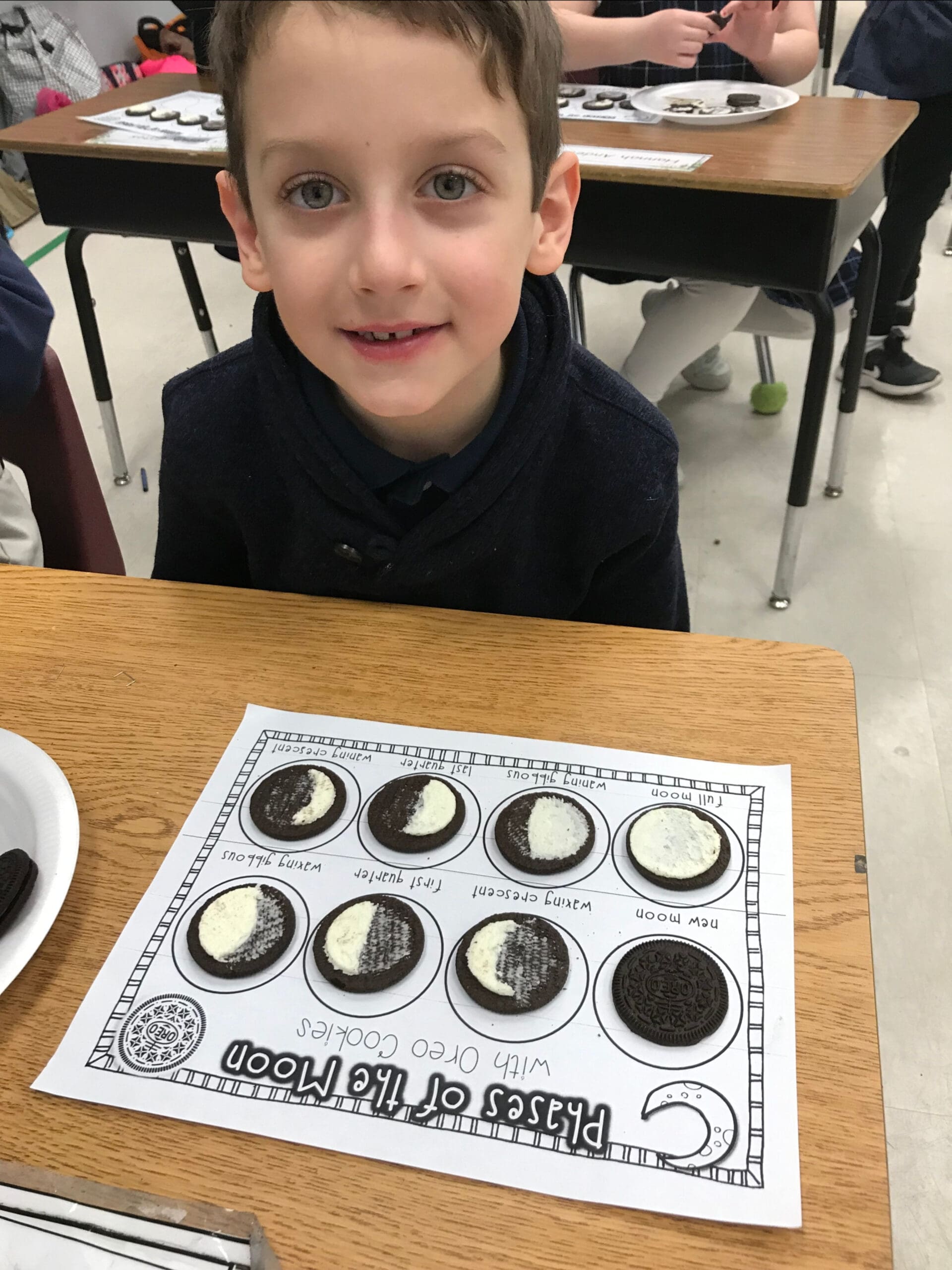 1st Grader with oreo moon phase calendar